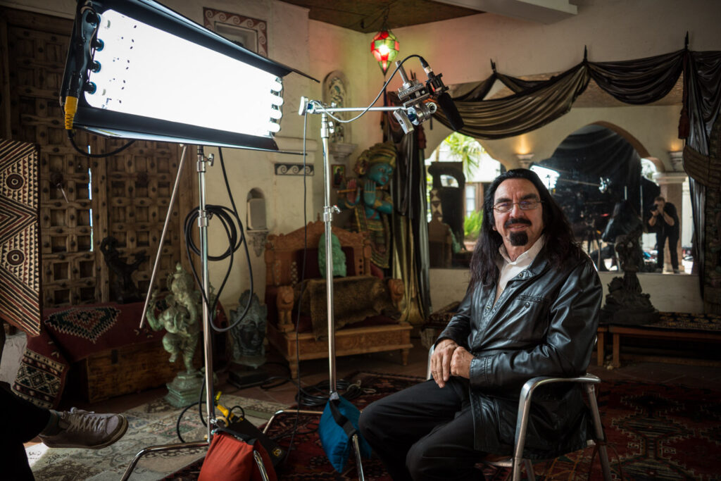 Behind the scenes of Struggle with producer/interviewee George DiCaprio with lights, camera, and cinematographer/photographer Dustin Pearlman in the reflection behind him
