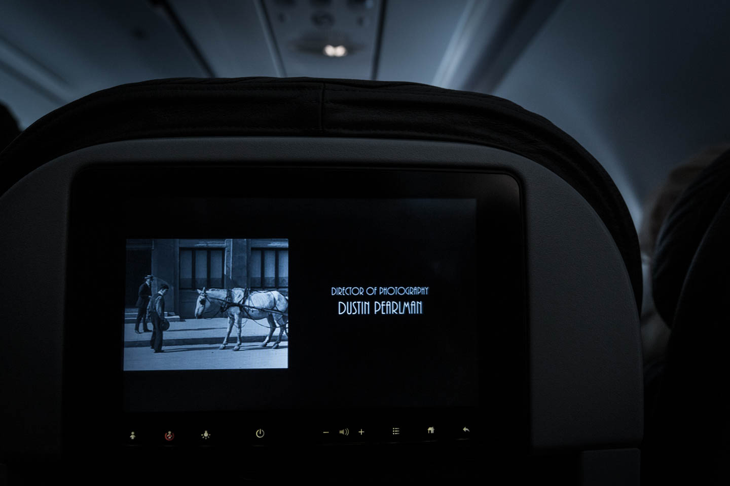 Cinematographer Dustin Pearlman watching The Great Buster documentary on an American Airlines flight