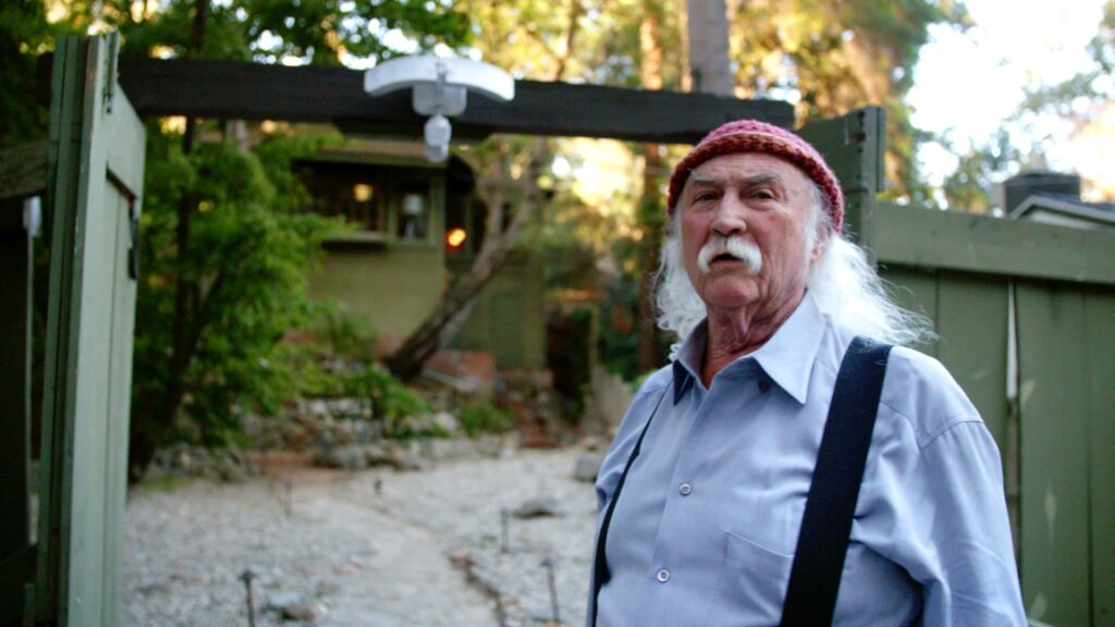 Frame grab from David Crosby: Remember My Name of Crosby sitting outside the Laurel Canyon Country Store