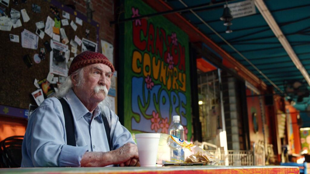 Frame grab from David Crosby: Remember My Name of Crosby sitting outside the Laurel Canyon Country Store