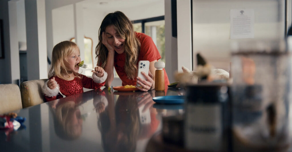 Magnolia and Mom on a FaceTime in a modern kitchen