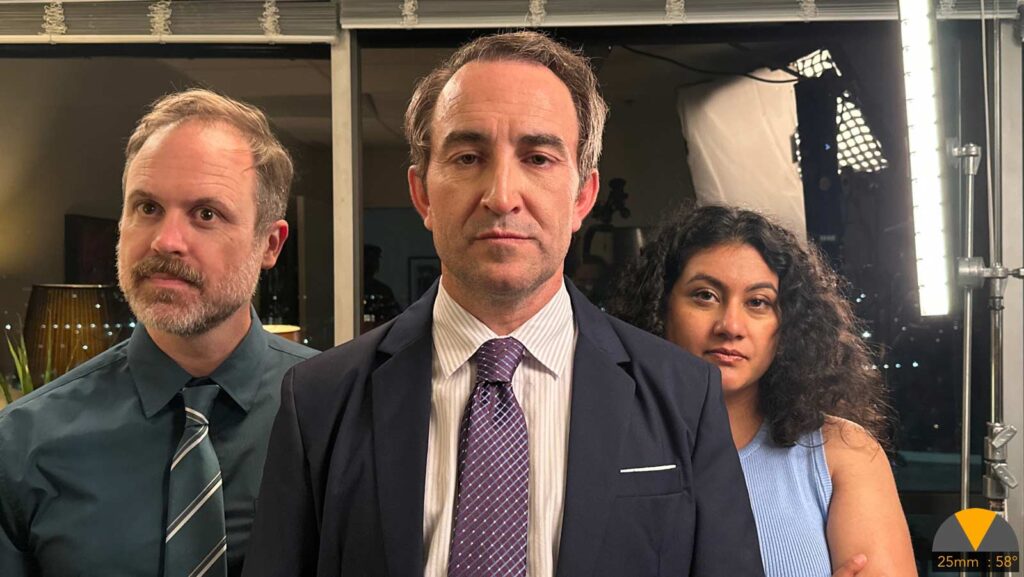 three people stand united in a menacing manner