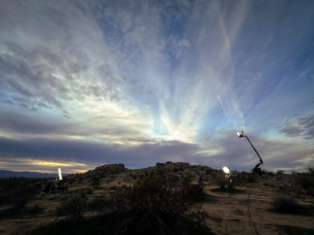 From the set of Illegal Aliens, wide shot of a desert landscape with movie lighting