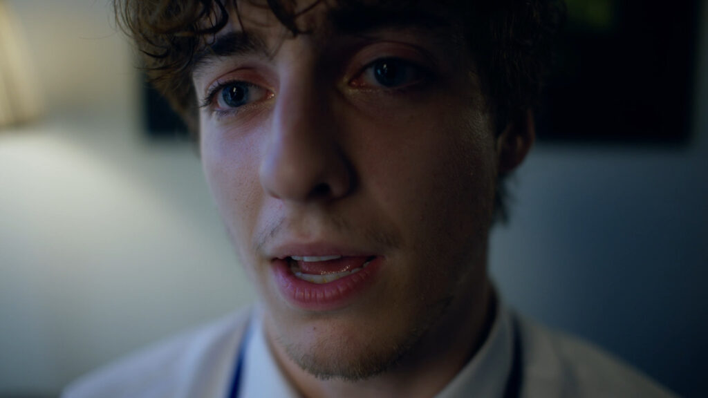 From Sick Days, an extreme close up of a man's face